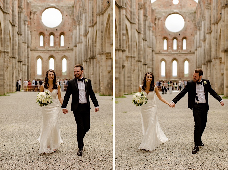 bride and groom walking hand in hand at san galgano abbey