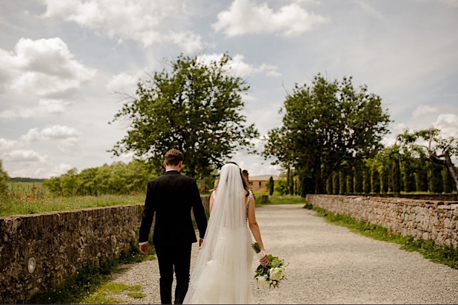 Bride and Groom wlaking together at san galgano abbey