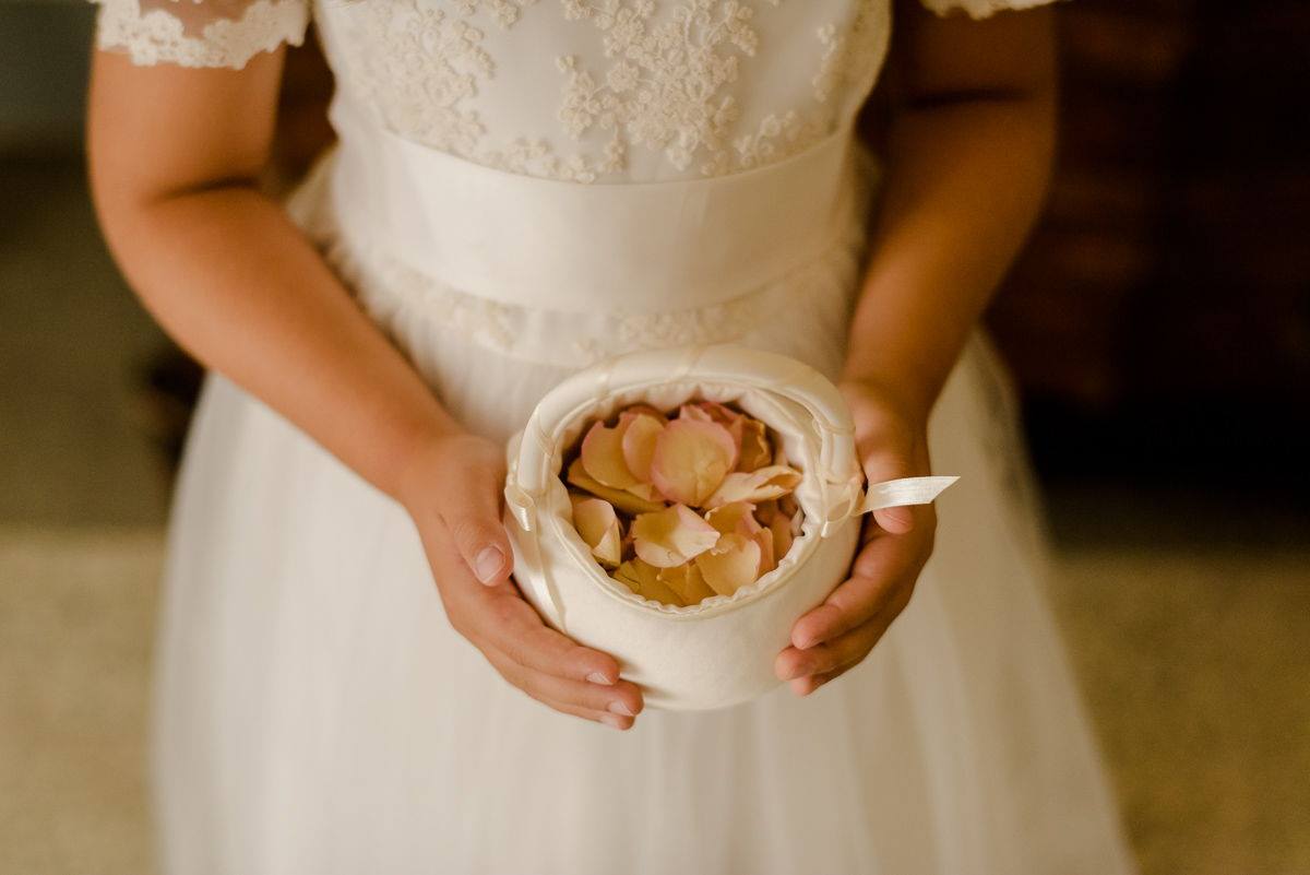 Flowers petals hold by flowers girl at wedding