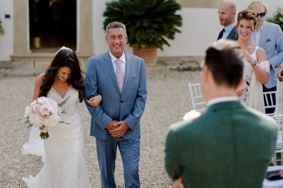 here comes the bride with her father