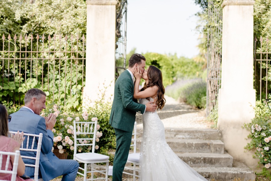 wedding ceremony at Tenuta di Pratello Country Resort bride and groom kissing