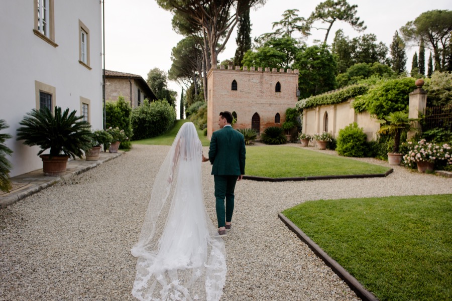 bride and groom walking at Tenuta di Pratello Country Resort