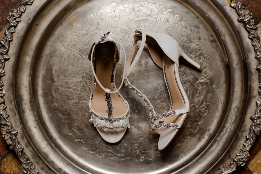 bridal shoes on a silver plate