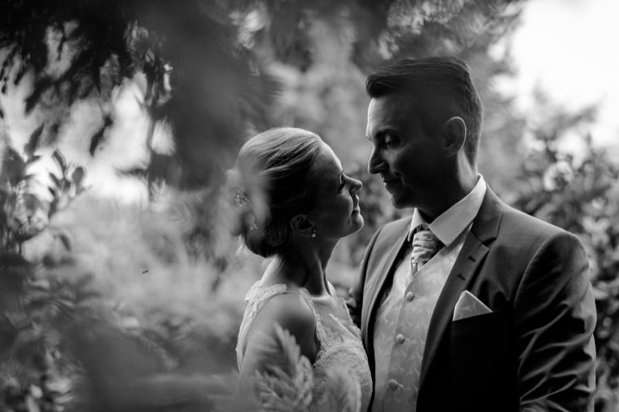 intimate moment bride and groom black and white at montegufoni castle