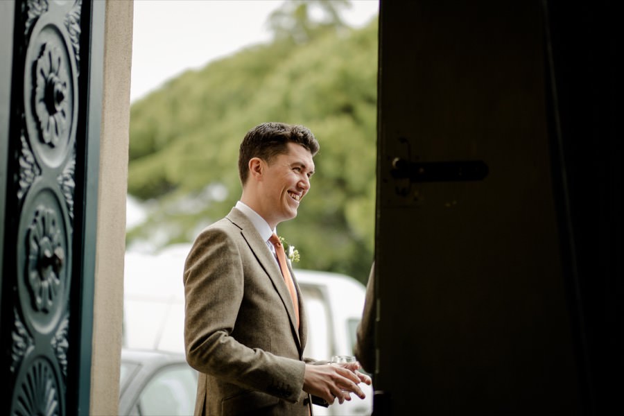 groom smilinkg outside