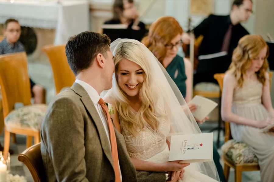 candid photo of bride and groom smiling during the wedding ceremony