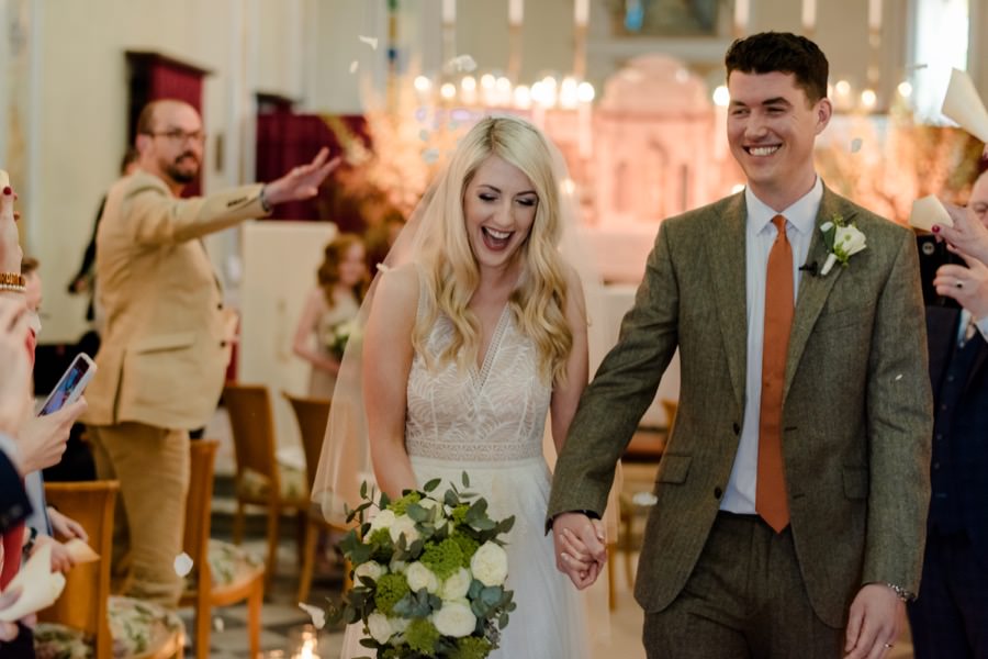 trow of petals and confetti to the bride and groom