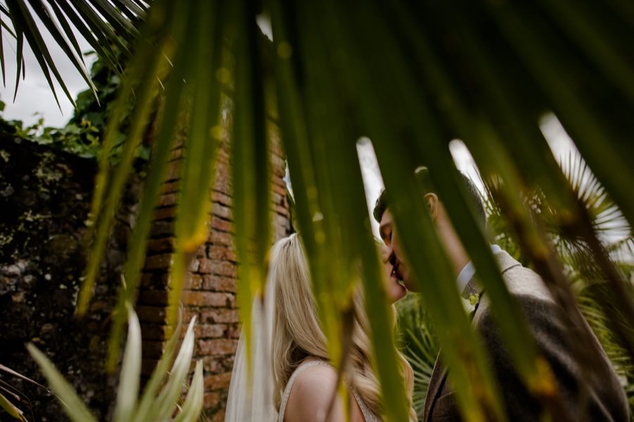 Bride and groom kissing each other