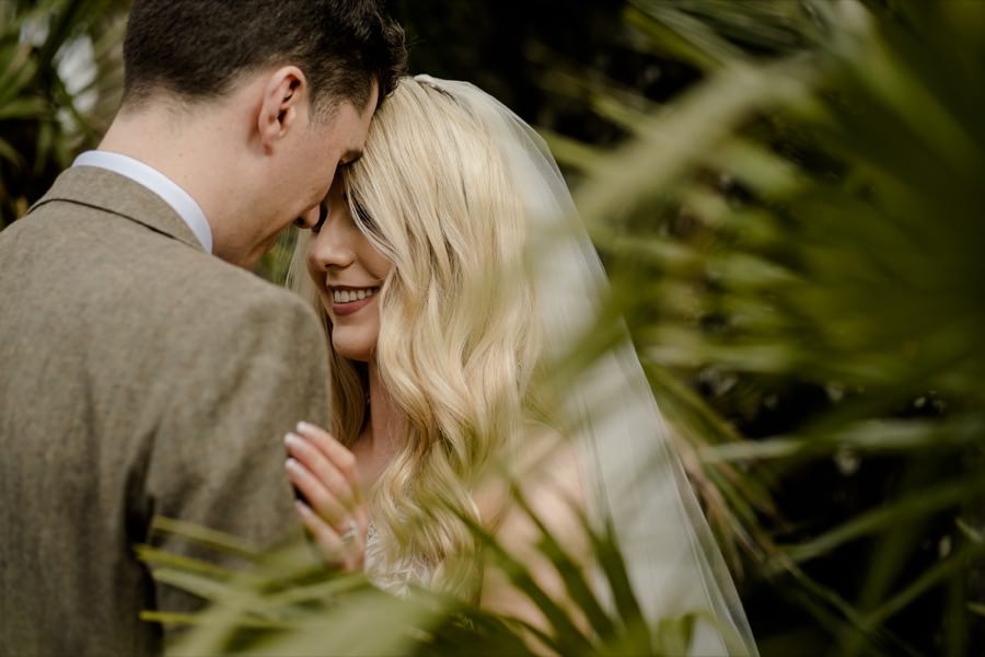 bride and groom together embracing each other