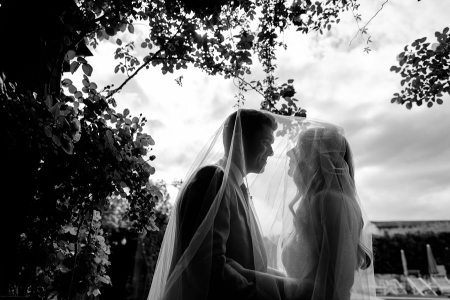 Bride and Groom with sky backlight black and white photo