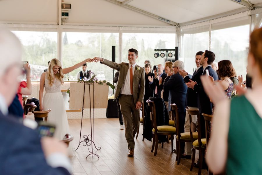 here come the bride and groom