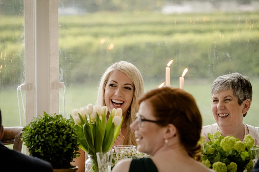 Bride smiling at dinner