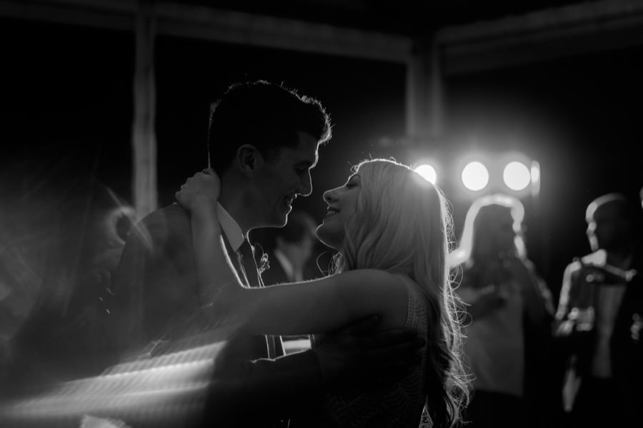 Romantic first dance of bride and groom black and white photo