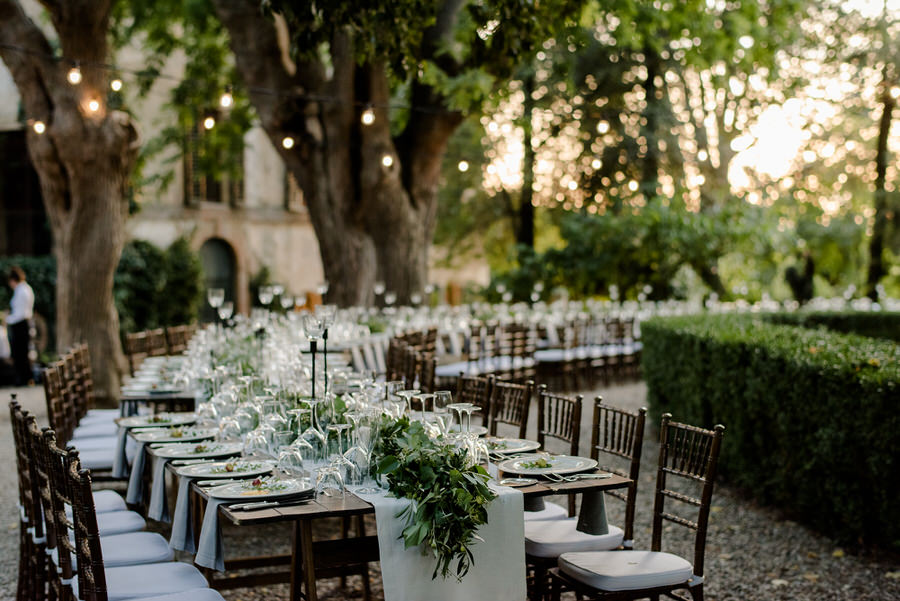 wedding table setup in tuscany with fresh greenery