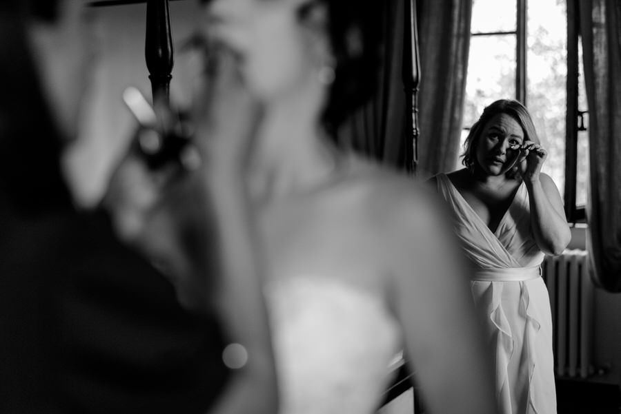 bridesmaid crying candid photo in black and white