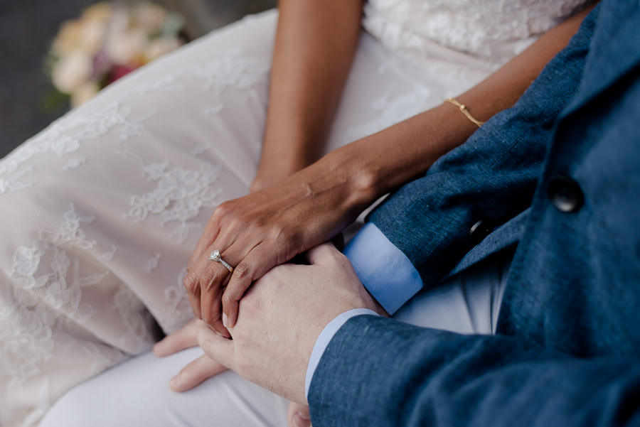 details of hands of bride and groom