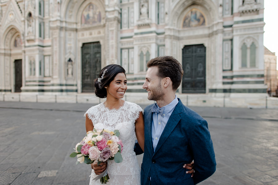 Wedding couple walking together in florence