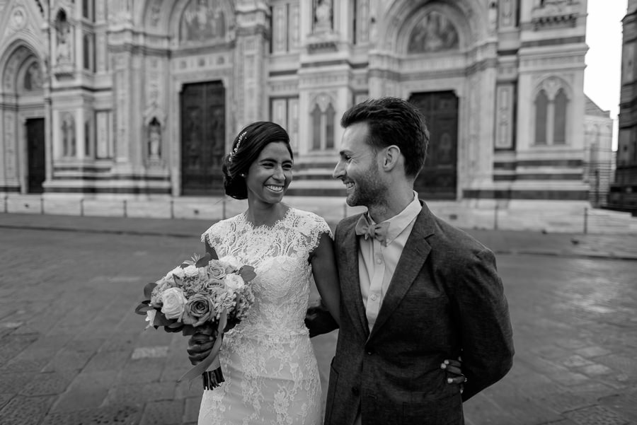 Wedding couple walking together in florence black and white photo