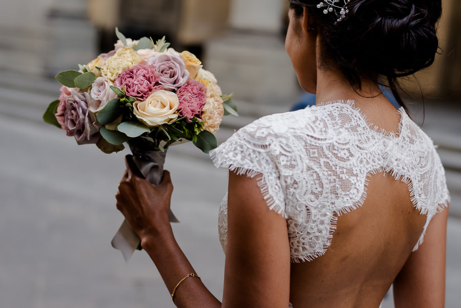 bride with her bouquet candid photo