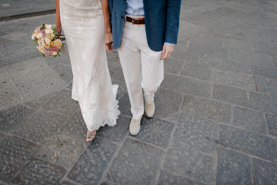 bride and groom walking together in florence