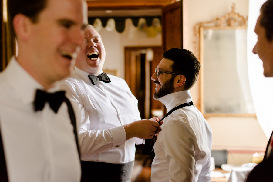 candid moment during the getting ready of the groom at borgo stomennano