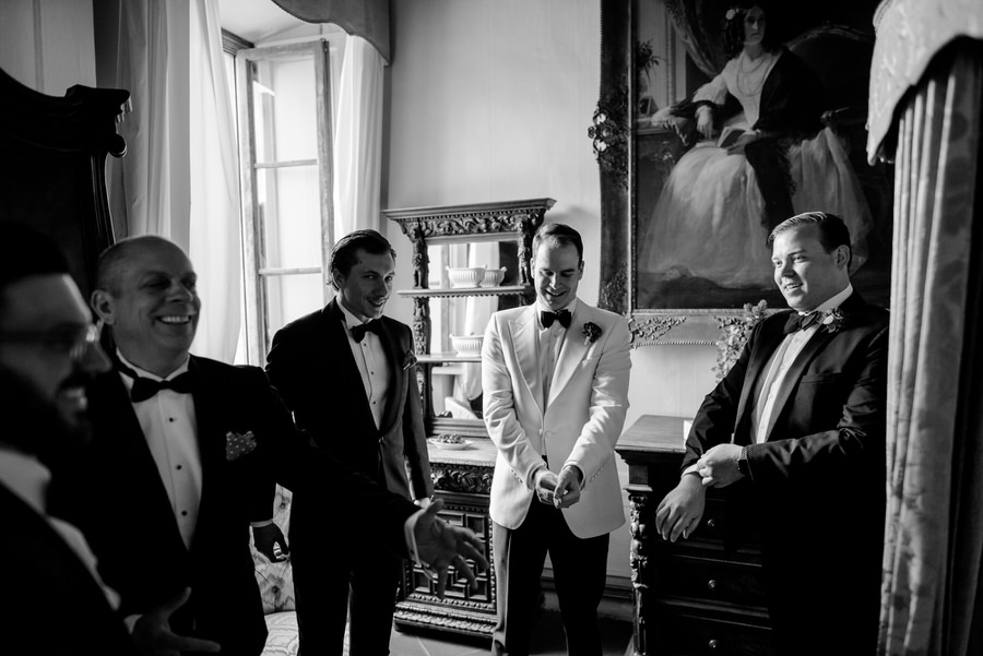 getting ready of the groom with his bestmen black and white