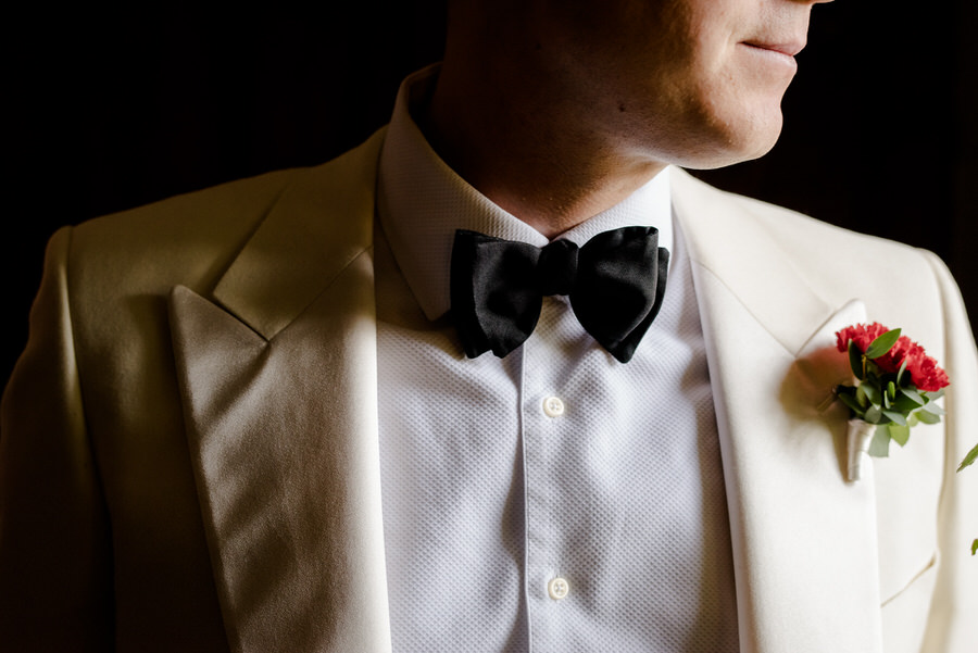 detail of the bow-tie of the groom