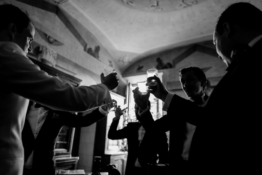 detail of the toast with the groom and his bestmen