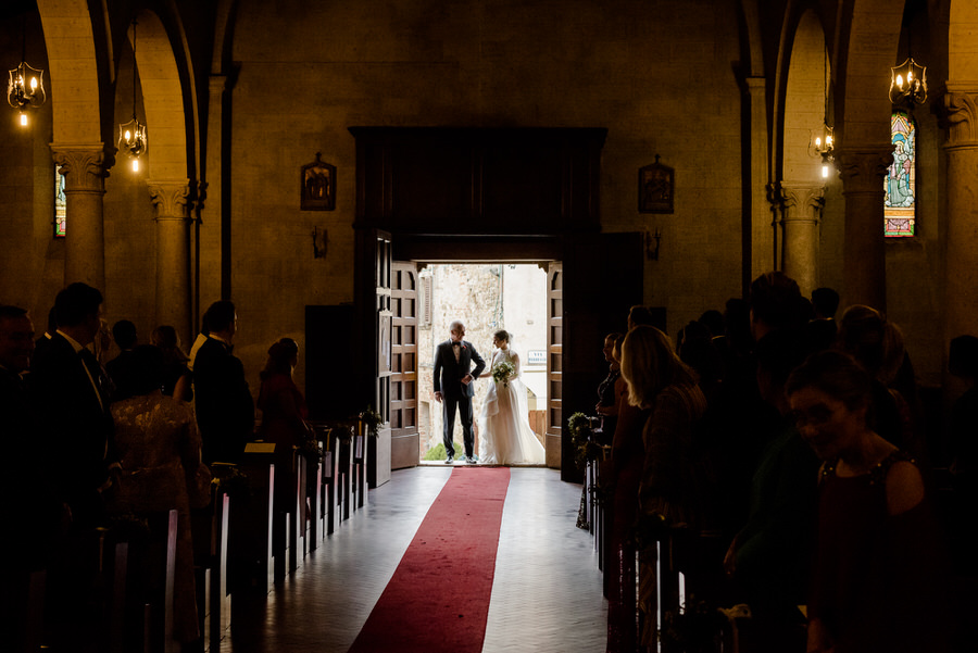 bride with her father entering in the church