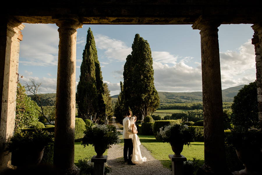 newlywed couple embracing each other at borgo stomennano