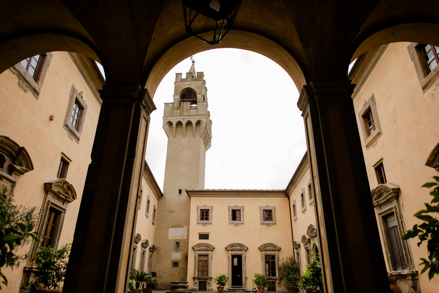 view of the courtyard of castello di montegufoni tuscany