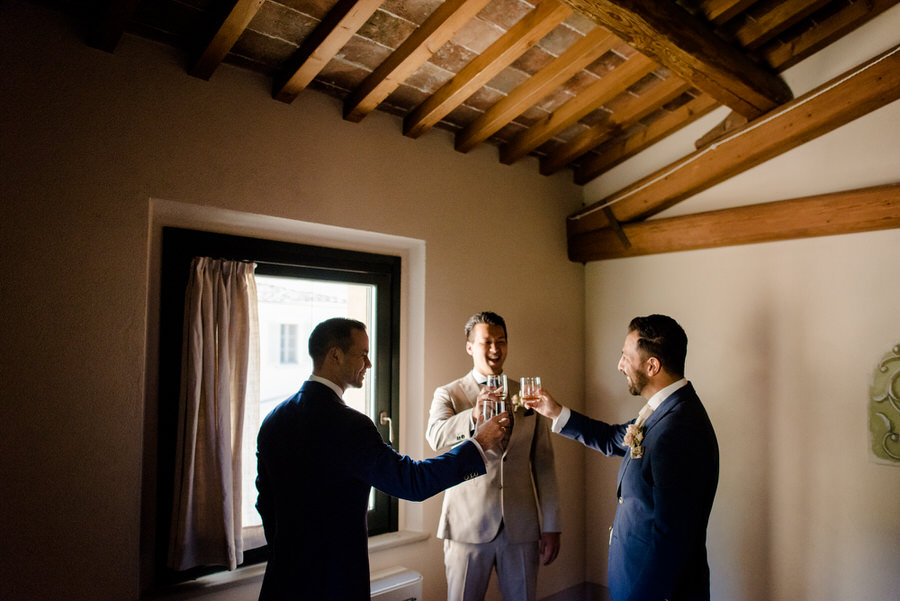 a toast of the groom with the groomsmen