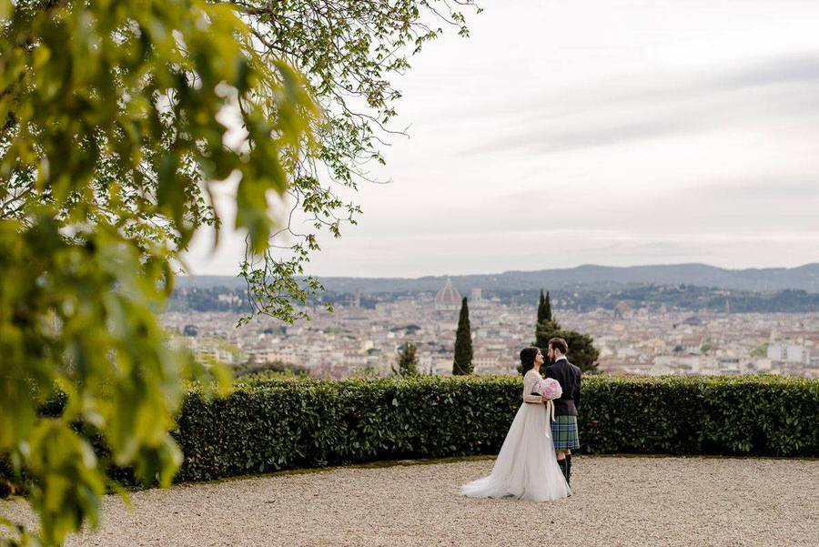 wedding couple embracing with Florence backdrop