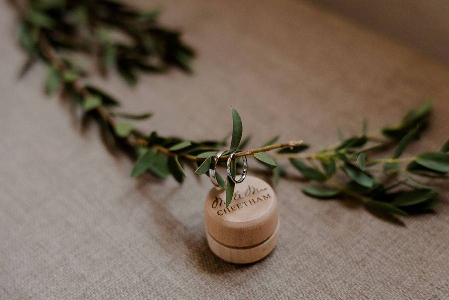 wedding rings inside olive leafs in tuscany