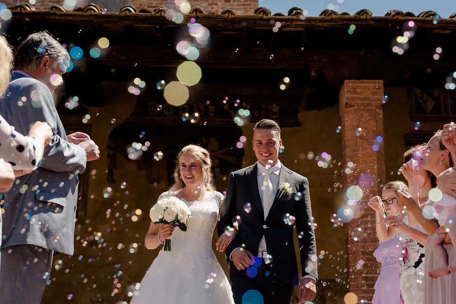 happy couple celebration in certaldo with soap bubbles