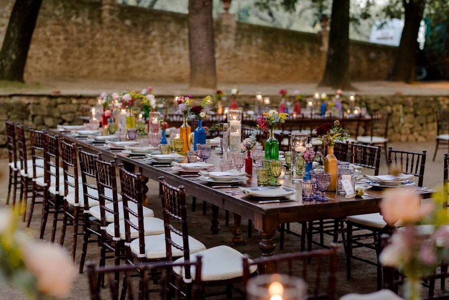 colourful tables in a wedding in a garden in tuscany