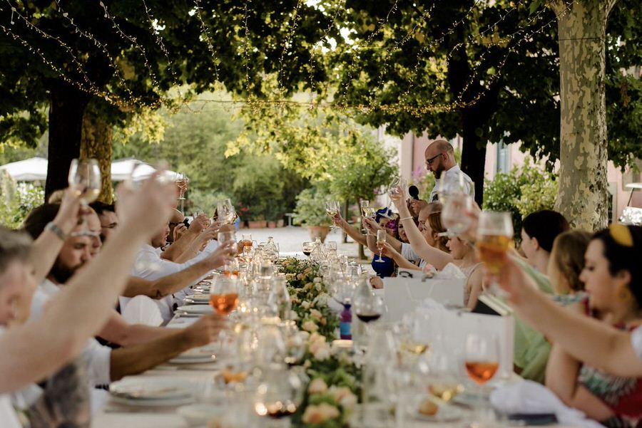 toast at wedding dinner in tuscany