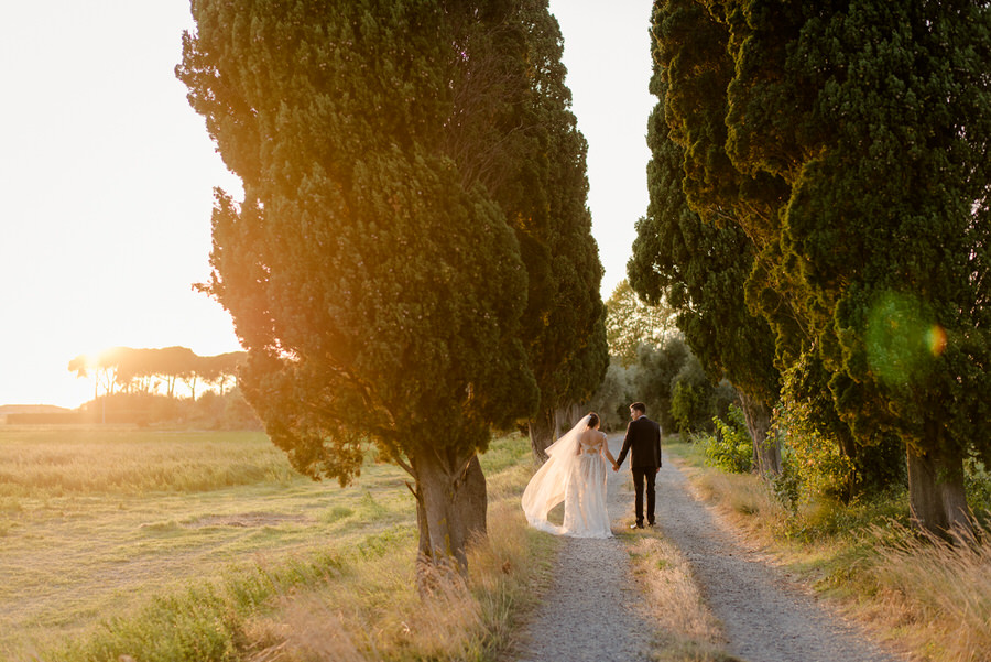 A romantic couple walking during the golden hour at Villa Ravano, San Giuliano Terme, Pisa