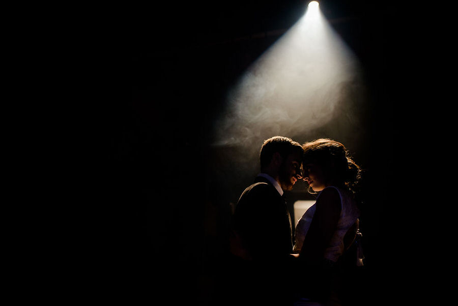 light spot on a wedding couple in a theather