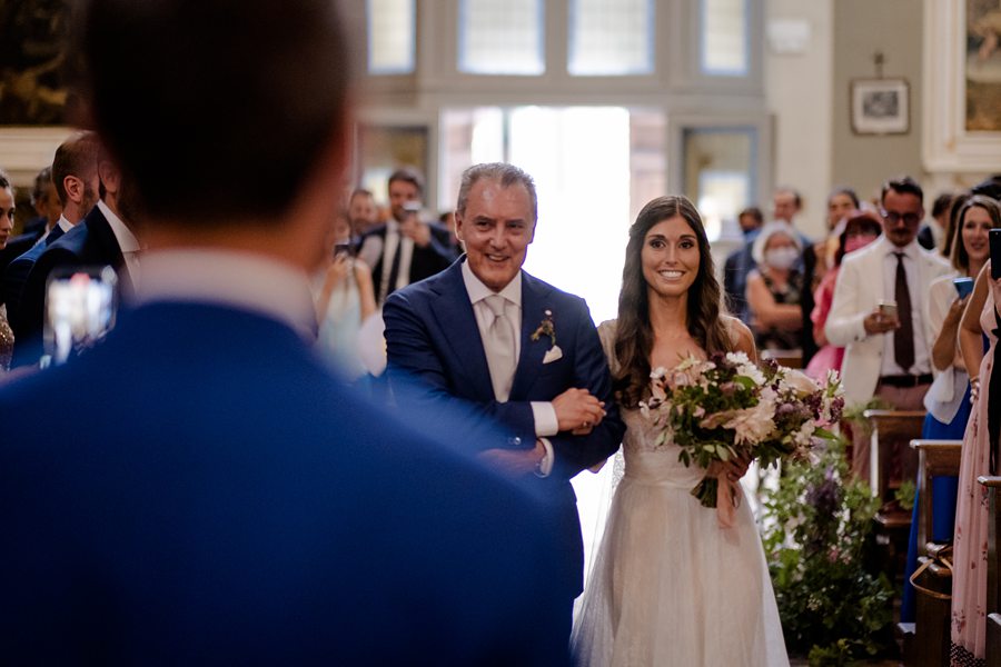 bride waking thru the aisle church tuscany