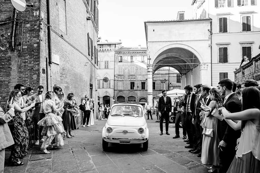 newlywed couple on a vintage car