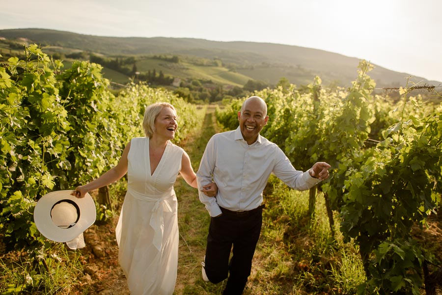 couple engaged in tuscany having fun