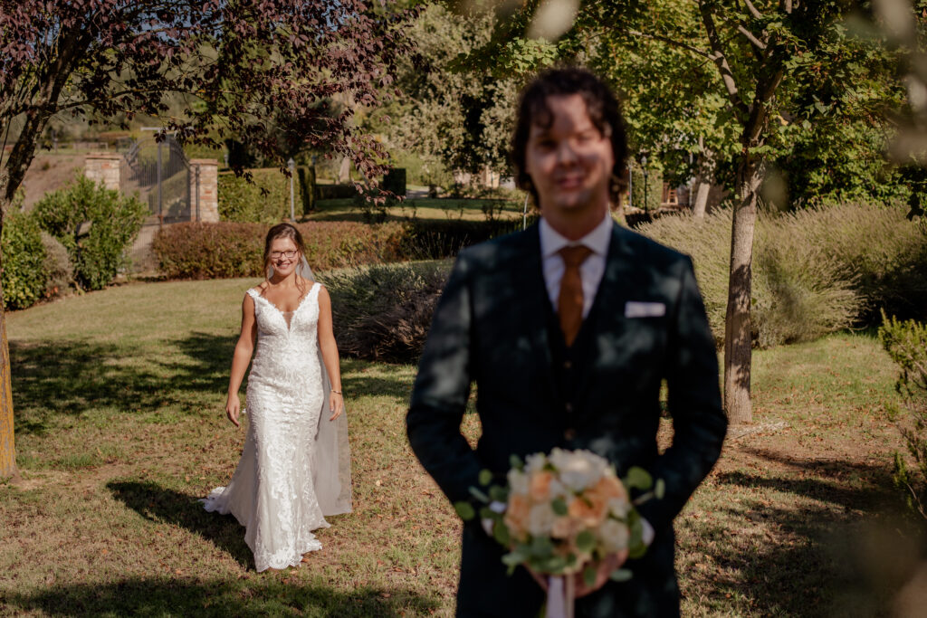 first look of bride and groom in a tuscan venue