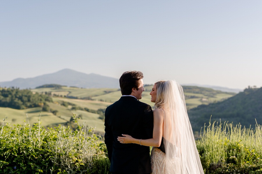 wedding couple smiling tuscany background